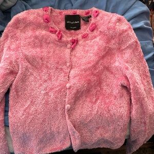 Small sweet pink sweater. Pink ribbon around the collar, super soft fabric